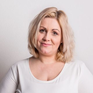 Portrait of an attractive overweight woman in studio on a white background.